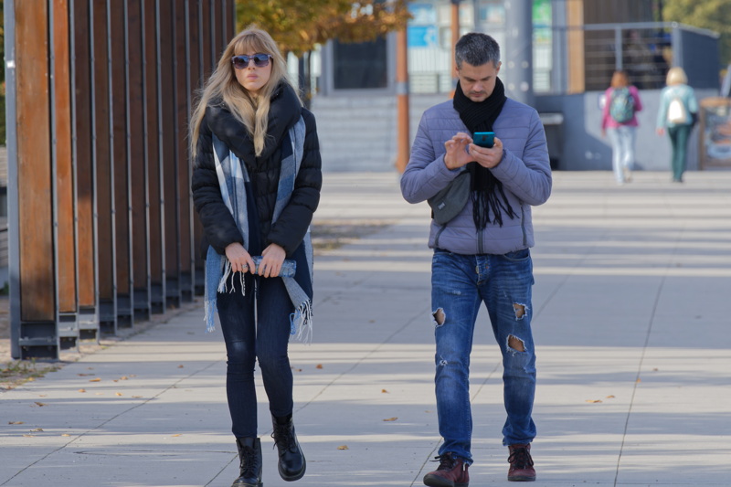 Young couple on sidewalk